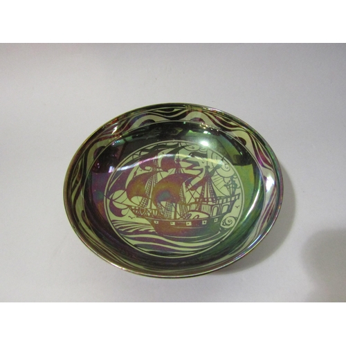 4272 - An early 20th Century lustre pottery bowl, the interior painted with a galleon, the exterior with de... 