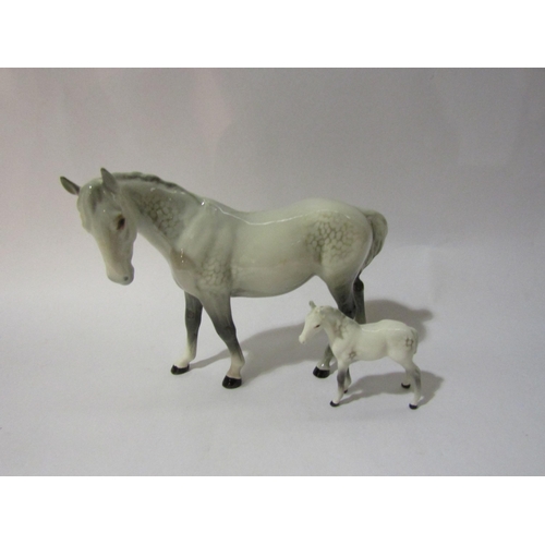 4273 - A Beswick Mare (facing left) in grey gloss, model no. 976 (ear repaired) together with a Beswick foa... 