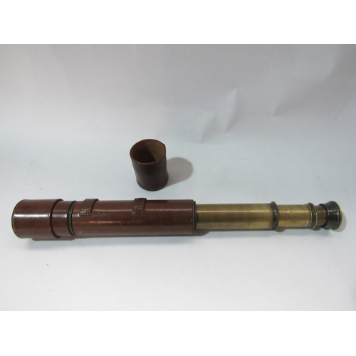 4300 - A brass four draw telescope in leather casing, possibly military, unnamed  (R) £25