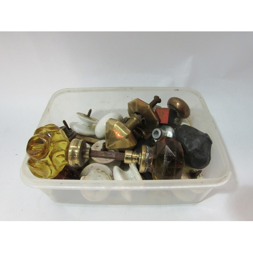 4301 - A box containing assorted bygone door knobs including porcelain and brass