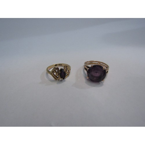 4337 - Two gold rings, one marked 9ct gold, each set with a purple colour stone, 7.1g