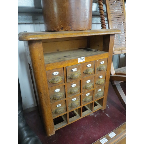 2147 - A 19th Century oak bank of 12 small drawers with cup and enamel numbers   (C)