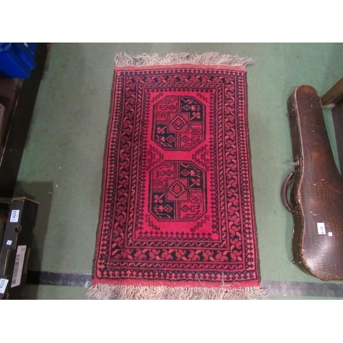 4178 - Three small late 20th Century Afghanistan wool rugs, red ground with line and motif details