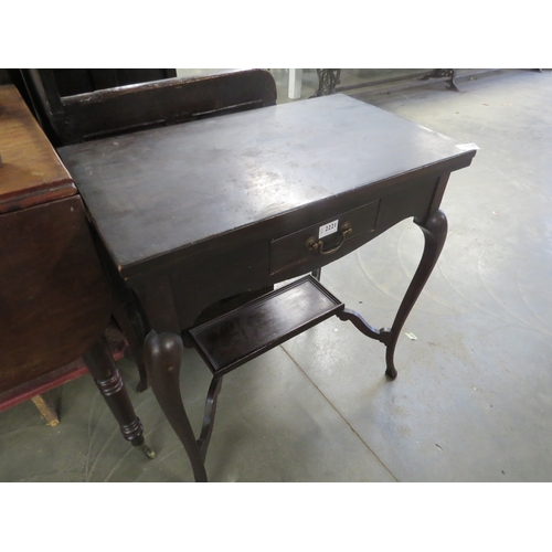 2184 - An Edwardian mahogany fold and swivel top games table