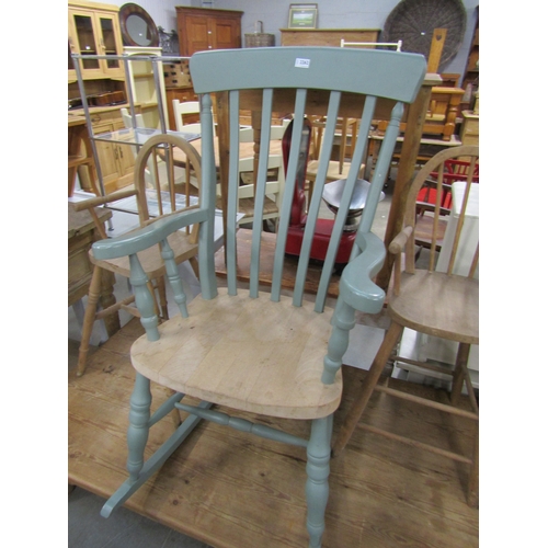 2320 - A painted pine slat back rocking chair