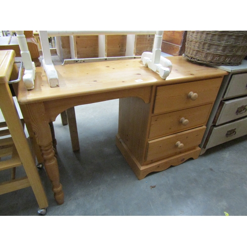 2326 - A pine three drawer desk