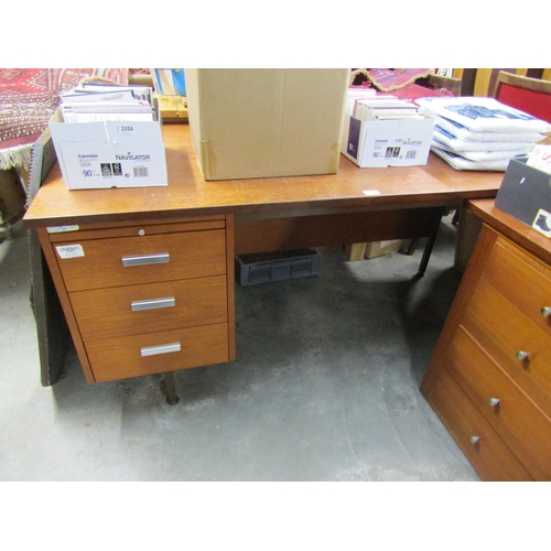 2386 - A teak corner desk     (R) £0