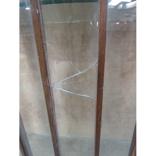 2256 - A 1930's walnut display cabinet, crack to glass