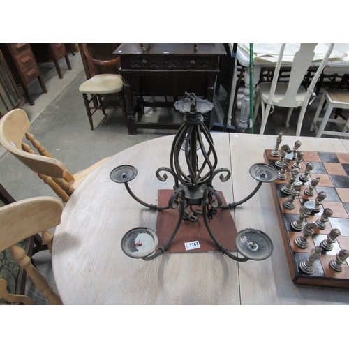 2267 - A wrought iron candelabra   (R) £10