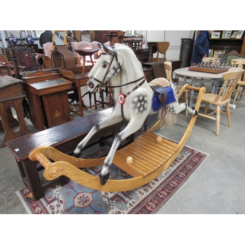 2270 - A large dapple grey rocking horse, on Victorian style bow rocker base   (R) £500