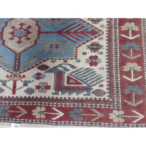 2271 - A red and blue Turkish wool rug 104 x 176cm   (R) £20