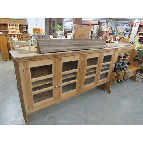 2286 - A pine and glazed four door wall cabinet 193cm wide