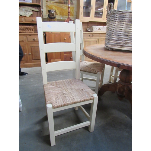 2303 - Four cream painted ladder back kitchen chairs