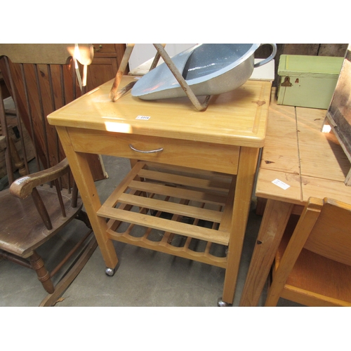 2316 - A small beech kitchen island with wine rack base