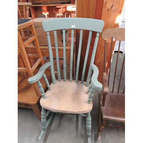 2320 - A painted pine slat back rocking chair