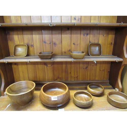 2358 - Nine teak wood bowls