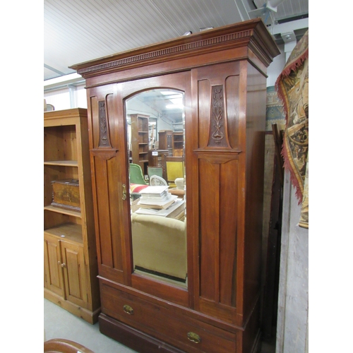 2361 - An Art Nouveau mirror door wardrobe with carved panel's over single drawer