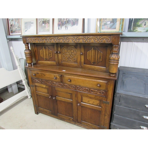 2371 - A heavily carved oak court cupboard