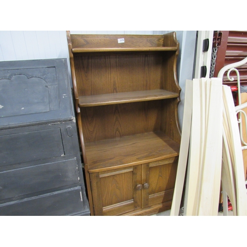 2376 - An Ercol bookcase on cupboard