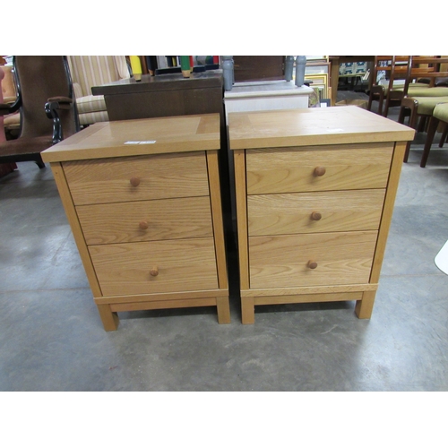 2395 - A pair of modern oak finish bedside drawers