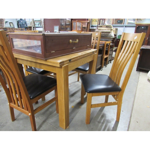 2431 - A modern oak extending dining table and 4 chairs