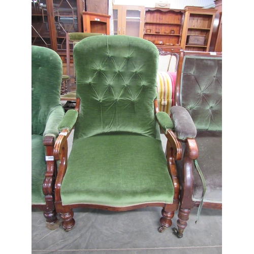 2451 - A green upholstered button back armchair on castors    (E)  £10-15