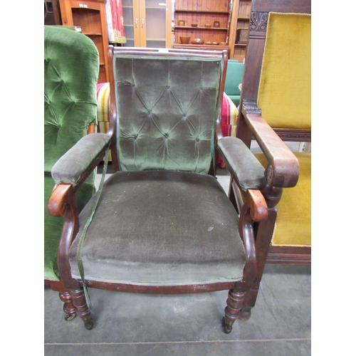 2452 - A Victorian green velour button-back armchair