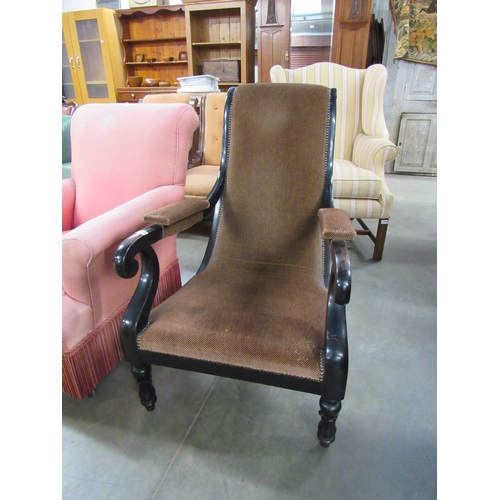 2456 - A Victorian black painted scroll arm chair