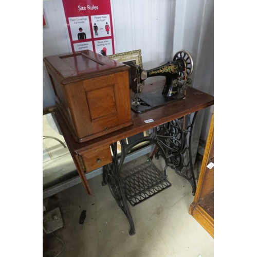 2118 - A cast iron Singer treadle sewing machine table