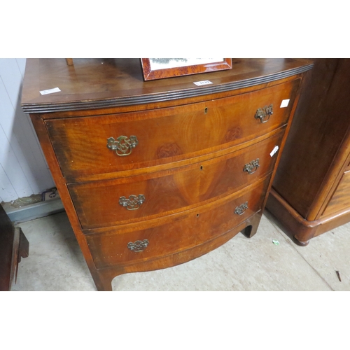 2139 - A Georgian style walnut chest of three bow fronted drawers