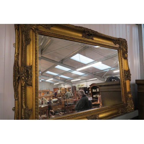 2143 - An ornate gilt framed mirror 120 x 90cm