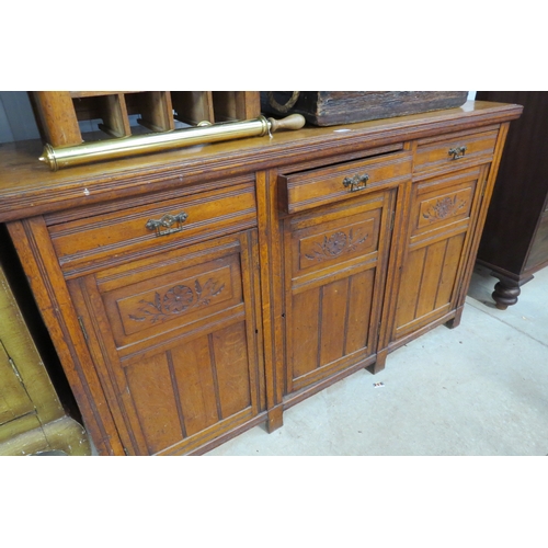 2149 - An Edwardian oak three drawer three door sideboard