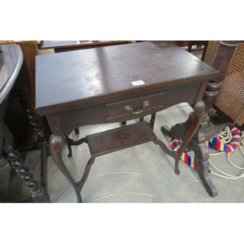 2184 - An Edwardian mahogany fold and swivel top games table