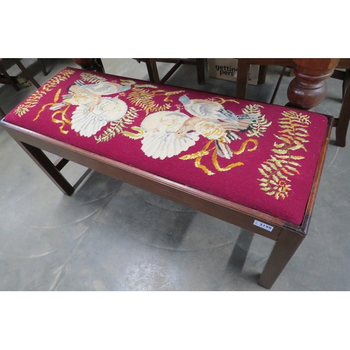 2198 - A mahogany duet stool with tapestry covered seat decorated with pigeons, 98cm long