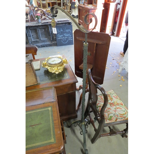 2216 - A pair of French wrought iron standard  with height adjustable stems