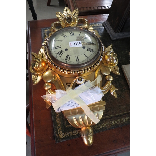 2219 - A gilt and gesso wall clock      (E)     £15-20