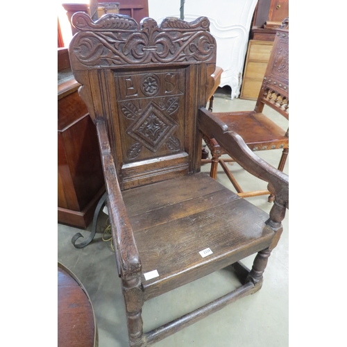 2228 - A 17th/18th Century oak panel back chair   (E) £100-150