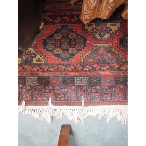 2446 - A red pattern rug    (E)  £15-20