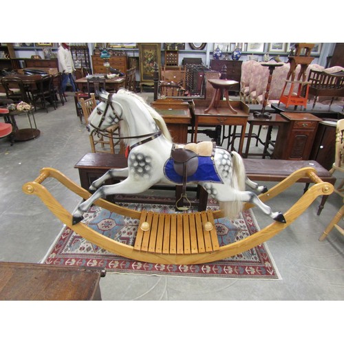 2270 - A large dapple grey rocking horse, on Victorian style bow rocker base   (R) £500