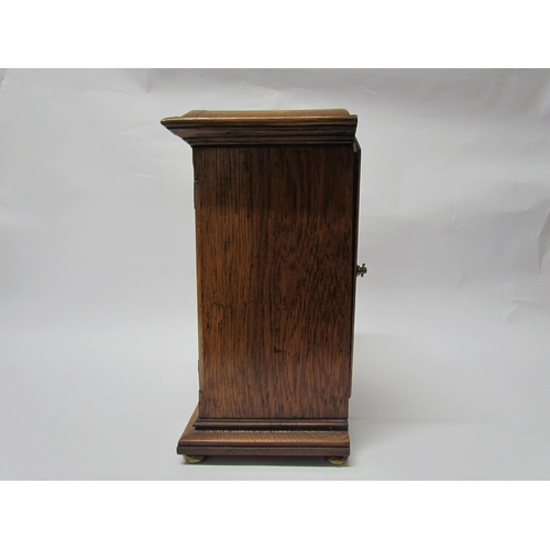 7766 - An early 20th Century oak cased Eureka clock with early electric movement and large balance wheel, A... 