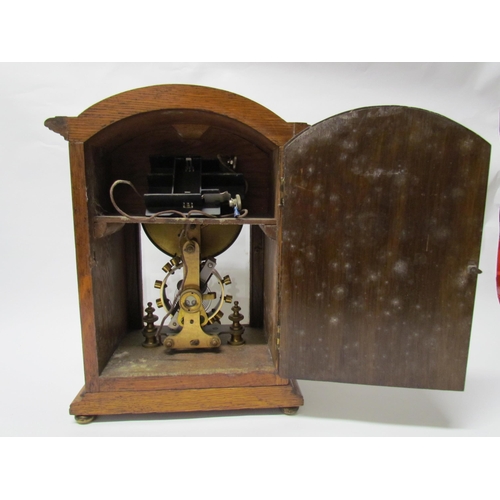 7766 - An early 20th Century oak cased Eureka clock with early electric movement and large balance wheel, A... 