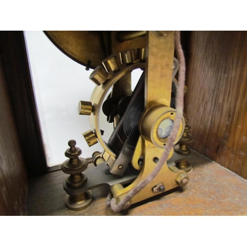 7766 - An early 20th Century oak cased Eureka clock with early electric movement and large balance wheel, A... 