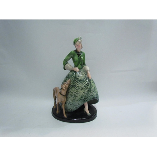 7780 - A Goldscheider figure of maiden in a green dress with hound, 35cm tall, marks to base, made in Germa... 