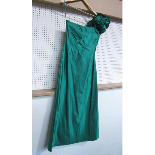 7838 - A 1980's Bill Blass stunning emerald silk full length evening gown. The bodice has a striking asymme... 