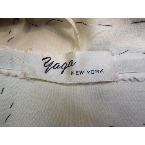 7838A - A stunning rare Mid Century cocktail dress by Yaga - The Madison Avenue, New York Couturier.  The to... 