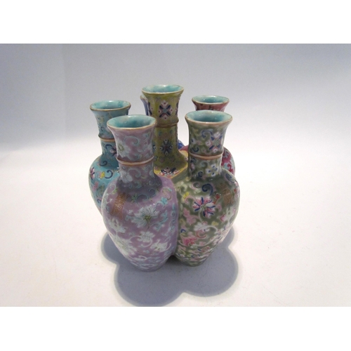 7448 - A pair of Oriental tulip vases in multicolour ground and foliate decoration, marks to base