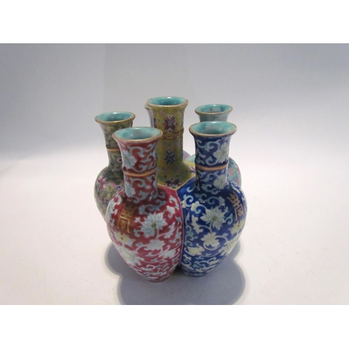 7448 - A pair of Oriental tulip vases in multicolour ground and foliate decoration, marks to base