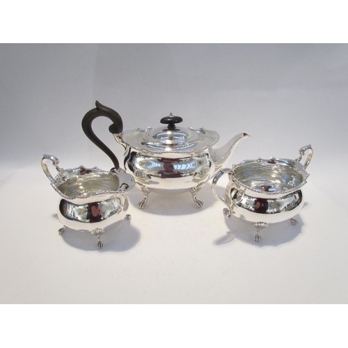 7456 - A Mappin & Webb silver three piece tea set, wavy beaded edge, on shell relief paw feet, scroll handl... 