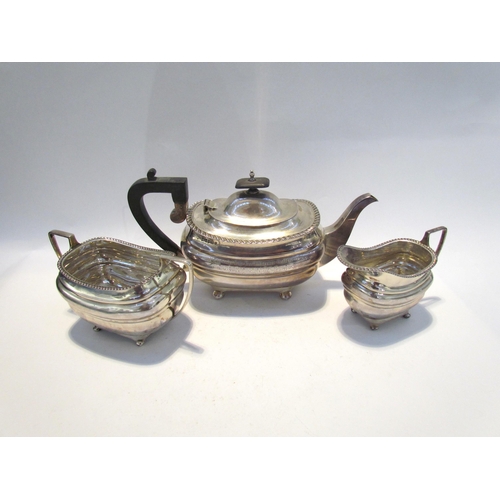 7457 - A Walker & Hall silver three piece tea set, gadrooned edge, presentation engraving dating to 1916, S... 