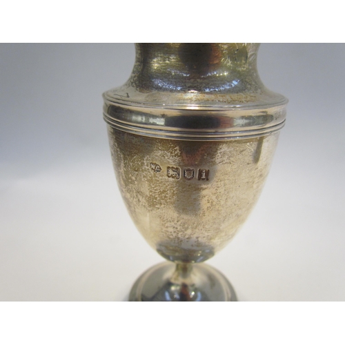 7459 - A William Comyns & Son silver sugar castor London 1904, 12.5cm tall. William Aitken silver shell for... 